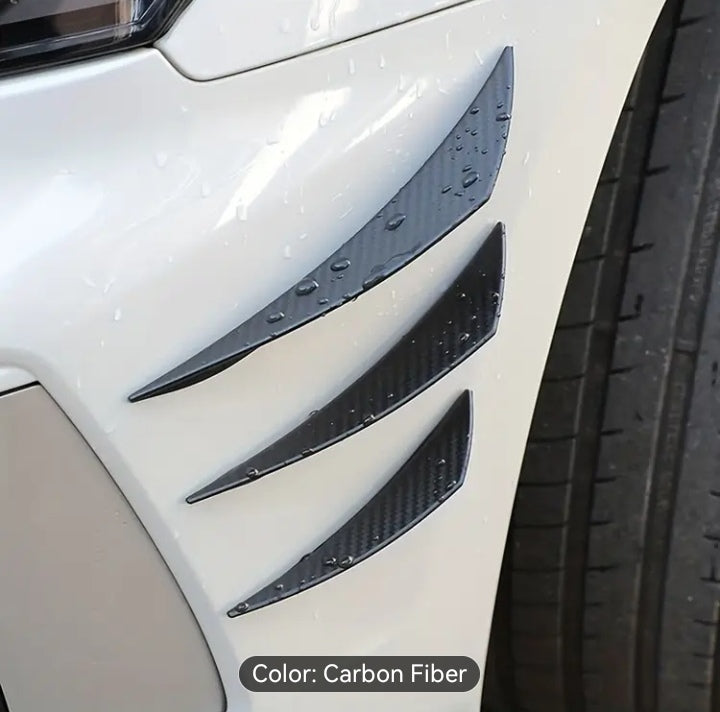 Shaped spoilers and wind knives for car bumper protection